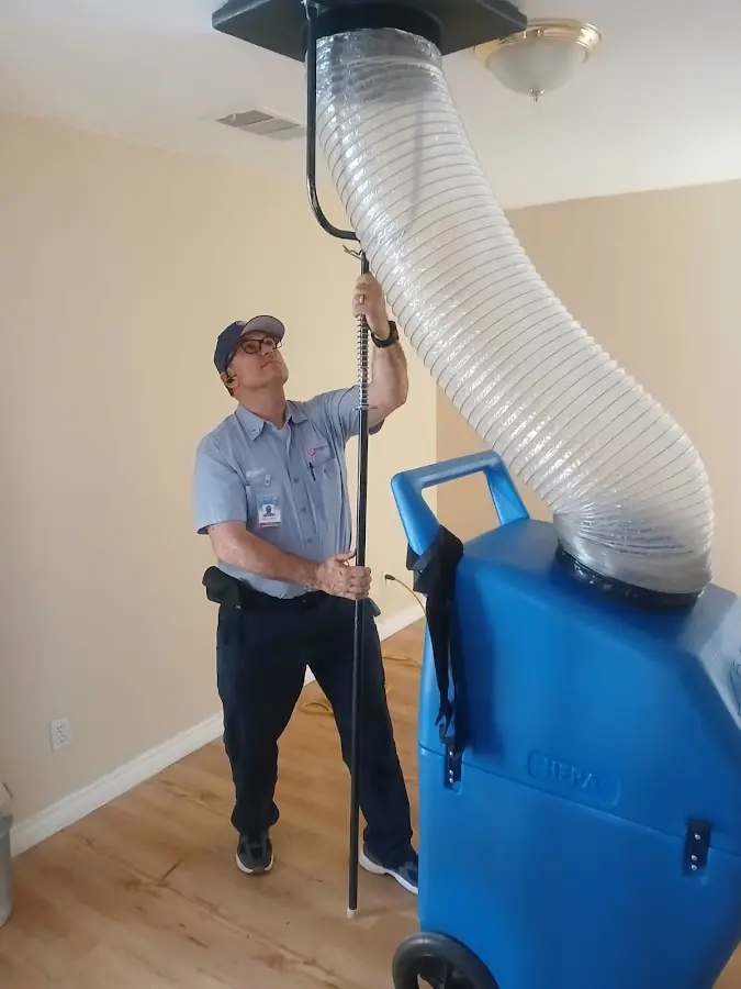 Furnace Tune-Up technician using HEPA equipment in Cincinnati